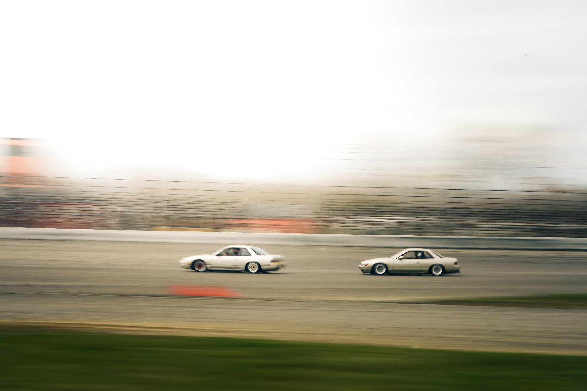 Two drift cars on track